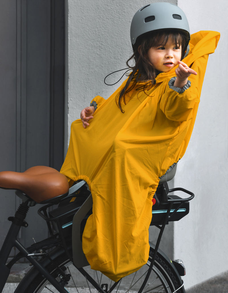 Protégez votre enfant sur le siège de vélo de la pluie