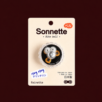 Sonnette de vélo noire Tokyo Bell sur son packaging Rainette
