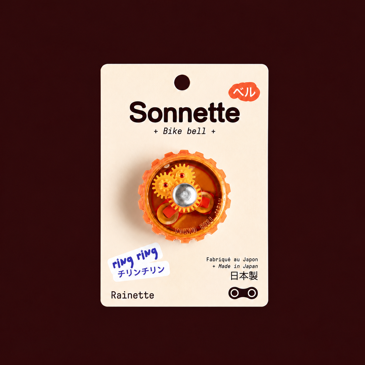 Sonnette de vélo orange Tokyo Bell sur son packaging Rainette