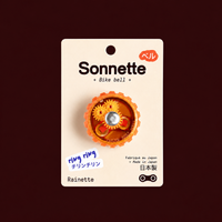 Sonnette de vélo orange Tokyo Bell sur son packaging Rainette